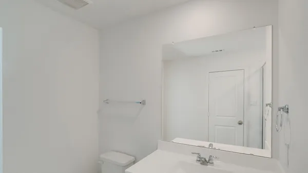 a bathroom with a shower and a sink