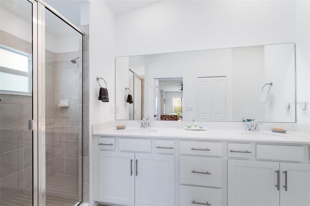 43992 Boardwalk Loop, Unit 1526 Punta Gorda, FL 33982 - Photo 13 of 48 a bathroom with a sink and a mirror