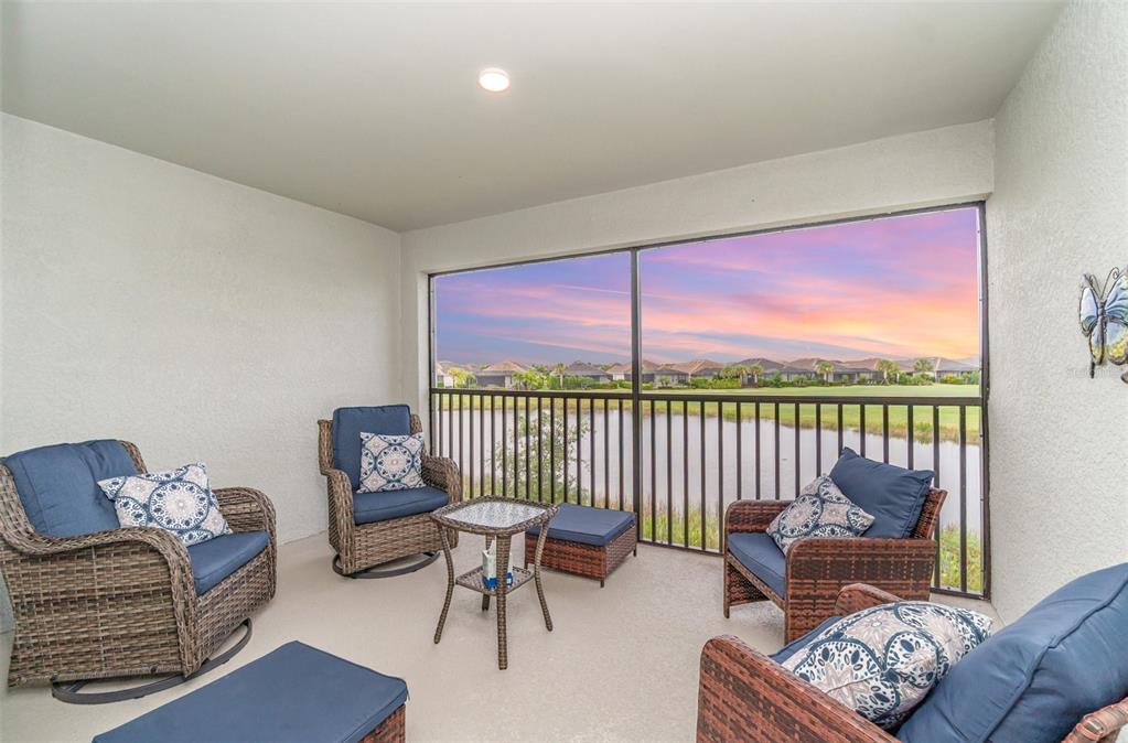 43992 Boardwalk Loop, Unit 1526 Punta Gorda, FL 33982 - Photo 2 of 48 a living room with furniture and a floor to ceiling window