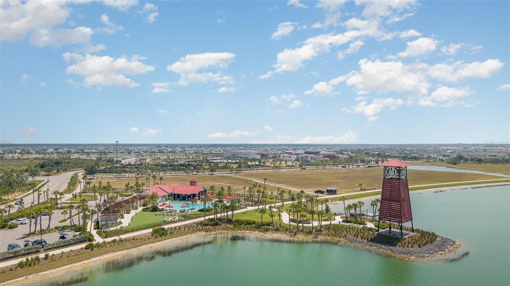 43992 Boardwalk Loop, Unit 1526 Punta Gorda, FL 33982 - Photo 46 of 48 an aerial view of residential building with outdoor space lake and trees all around
