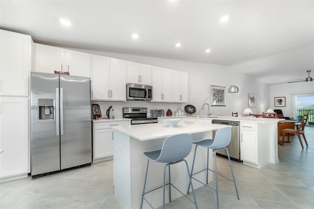 43992 Boardwalk Loop, Unit 1526 Punta Gorda, FL 33982 - Photo 5 of 48 a kitchen with appliances a sink and a refrigerator