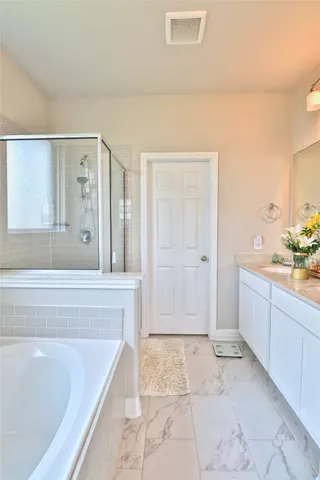 a bedroom with a bed and a table