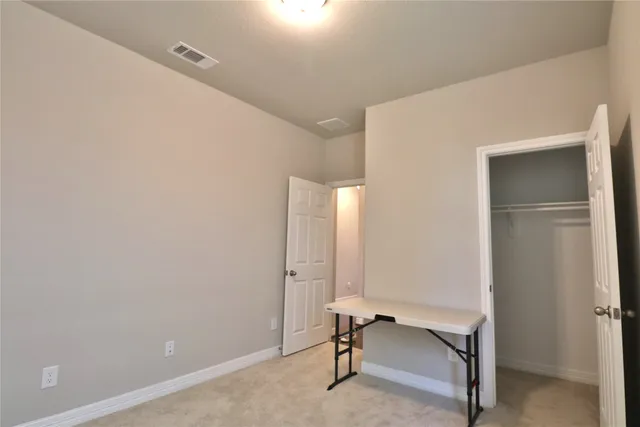 a bathroom with a shower a toilet and a sink