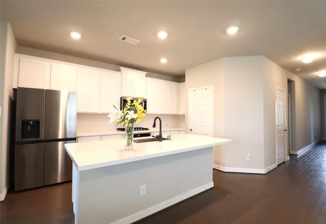 a kitchen with furniture and a counter top space