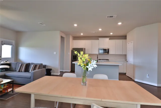 a kitchen with microwave cabinets and stove top oven
