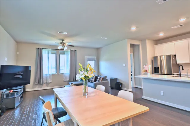 a kitchen with a table and chairs
