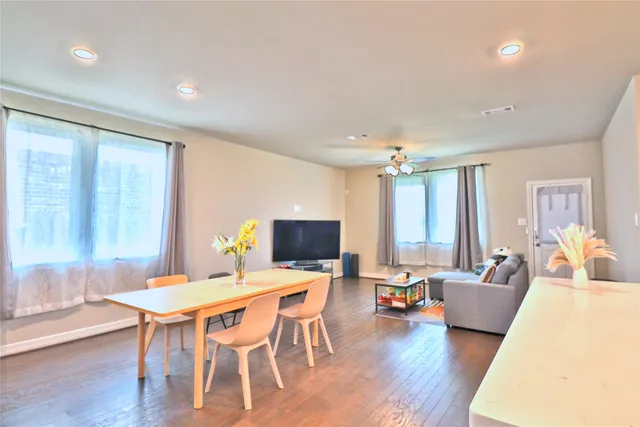 a living room with kitchen island furniture and a kitchen view