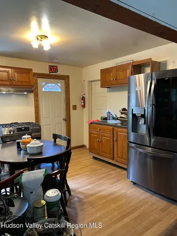 a kitchen with stainless steel appliances and a refrigerator