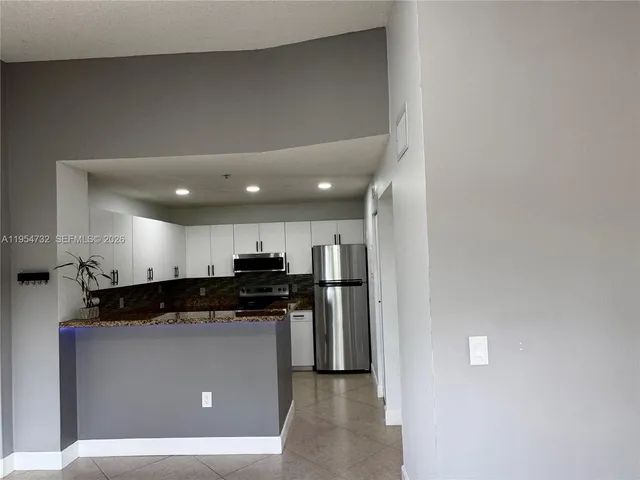 a view of a kitchen with a sink