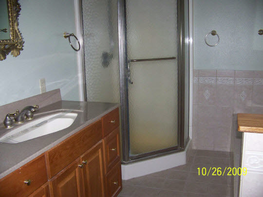 7663 East Rockton Road Roscoe, IL 61073 - Photo 5 of 10 a bathroom with a sink and a mirror