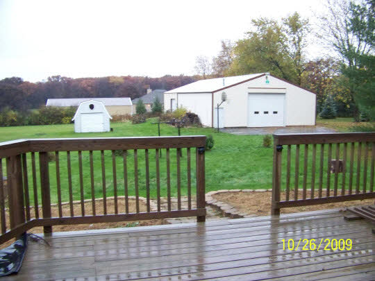 7663 East Rockton Road Roscoe, IL 61073 - Photo 8 of 10 a view of a deck with a yard