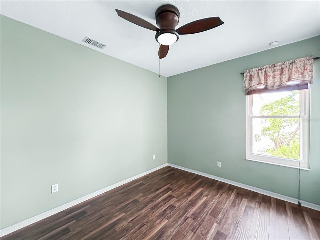 15598 Southwest 11th Terrace Road Ocala, FL 34473 - Photo 15 of 27 a room with window and wooden floor