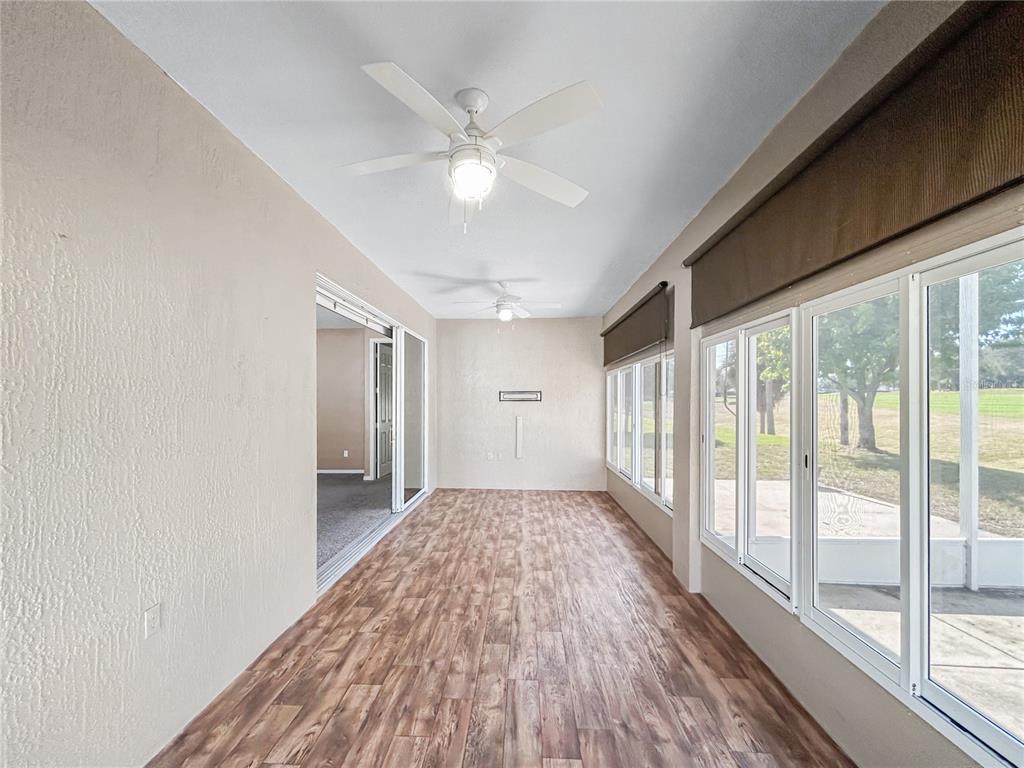 15598 Southwest 11th Terrace Road Ocala, FL 34473 - Photo 19 of 27 a view of a big room with wooden floor and windows