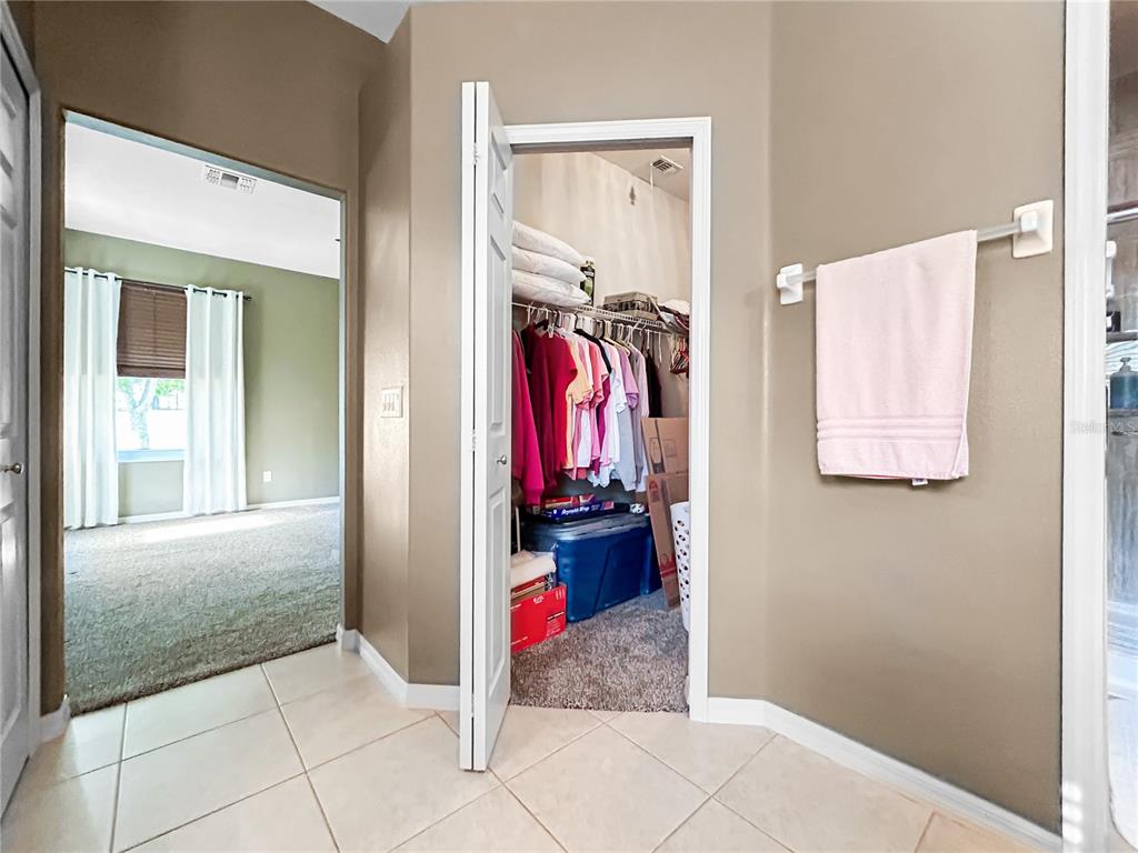 15598 Southwest 11th Terrace Road Ocala, FL 34473 - Photo 7 of 27 a view of a hallway that has closet and bathroom