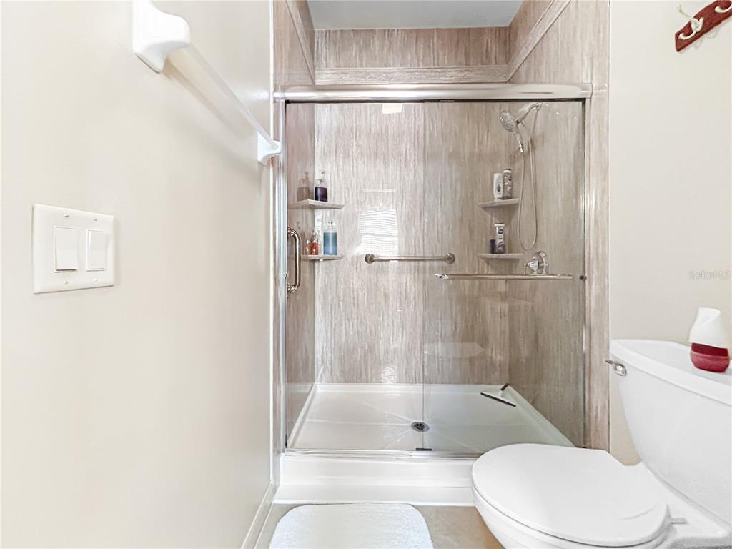 15598 Southwest 11th Terrace Road Ocala, FL 34473 - Photo 8 of 27 a bathroom with a bathtub and a shower