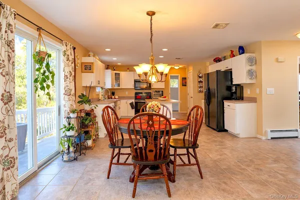 a view of a dining room with furniture window and outside view