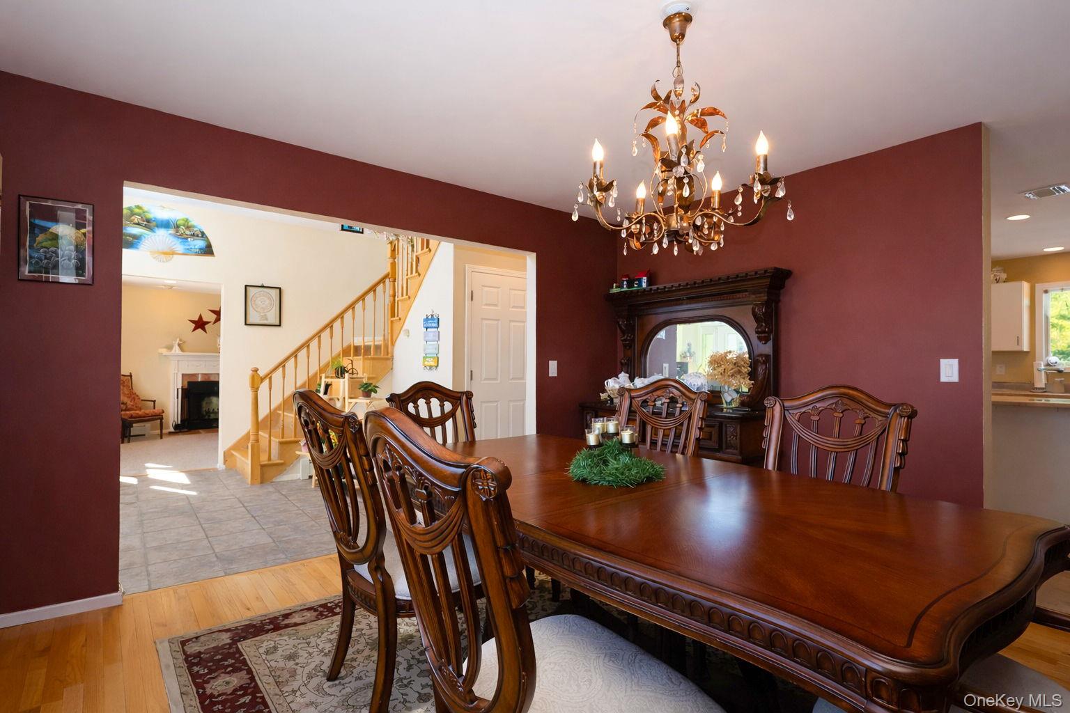 9 Mt Ridge Court Monroe, NY 10950 - Photo 19 of 49 a view of a dining room with furniture and chandelier