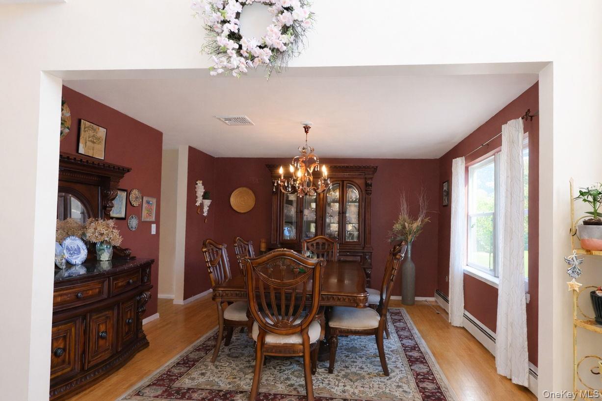 9 Mt Ridge Court Monroe, NY 10950 - Photo 20 of 49 a view of a dining room with furniture and chandelier