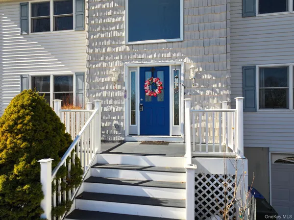 a front view of a house with large windows