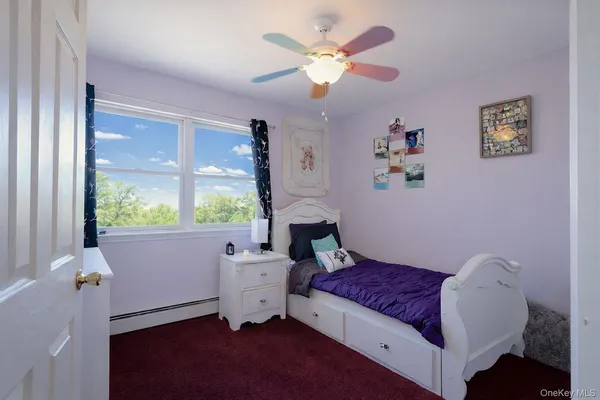 a bedroom with bed and a couch