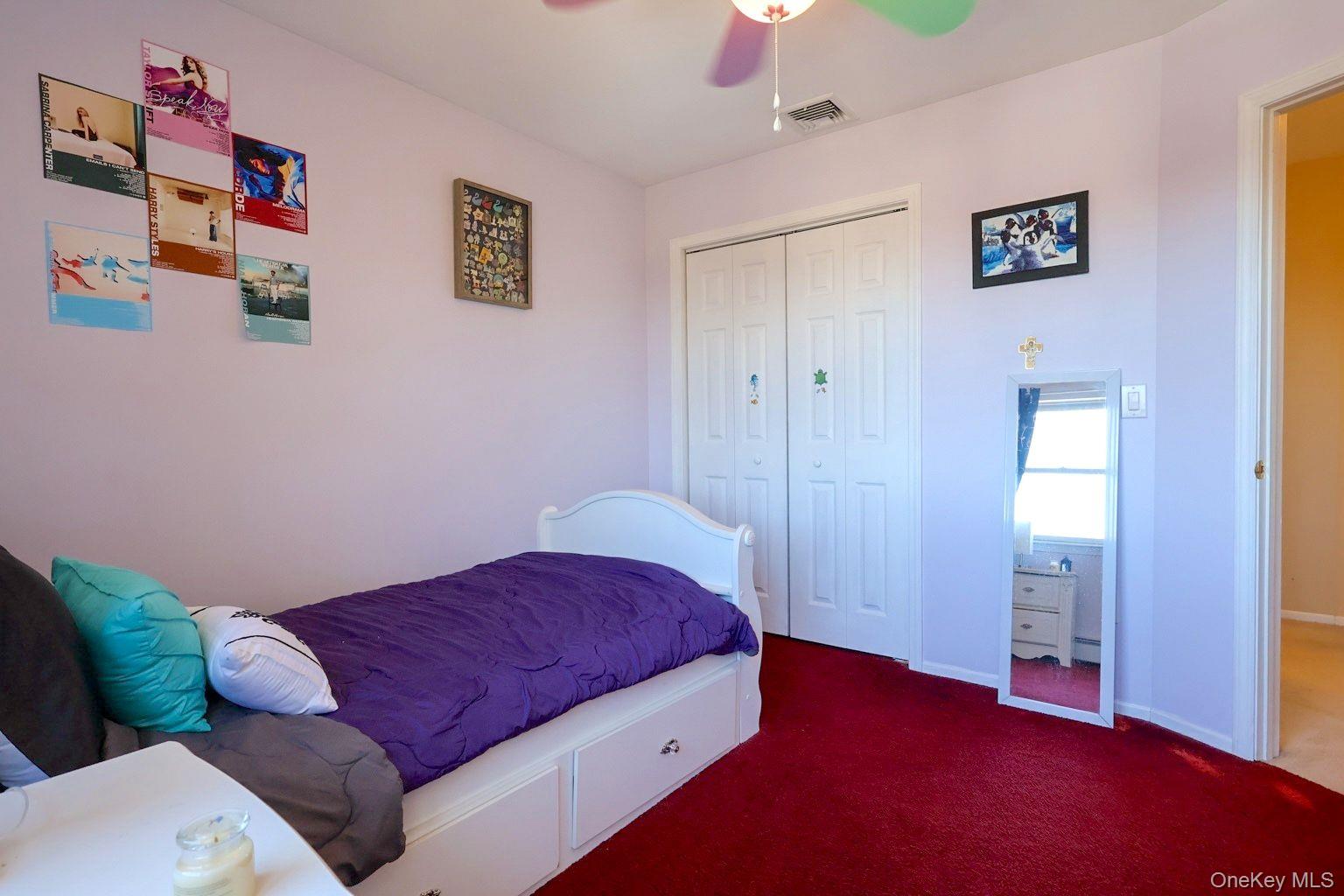 9 Mt Ridge Court Monroe, NY 10950 - Photo 28 of 49 a bedroom with bed and a couch