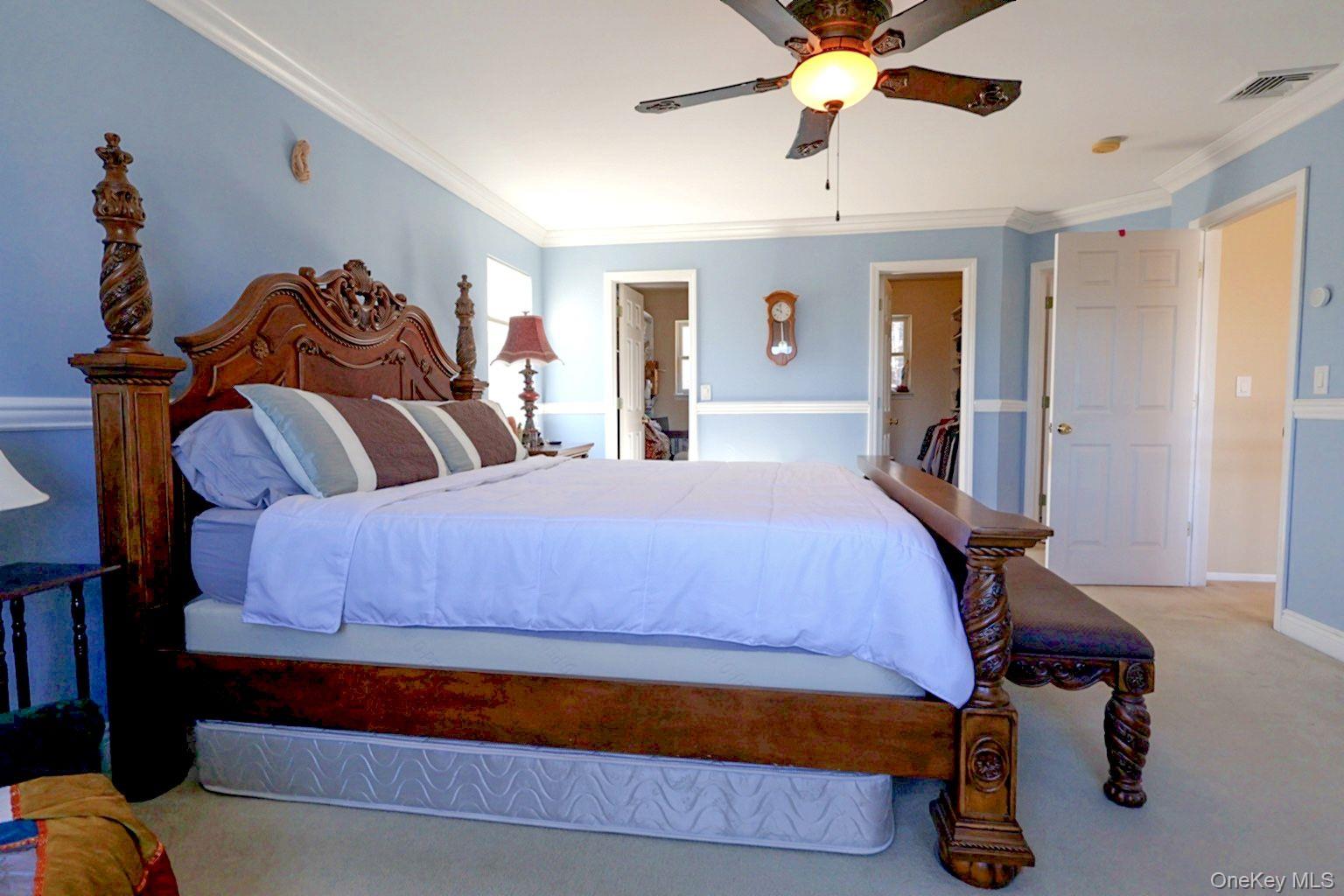 9 Mt Ridge Court Monroe, NY 10950 - Photo 35 of 49 a bedroom with a bed and a chandelier