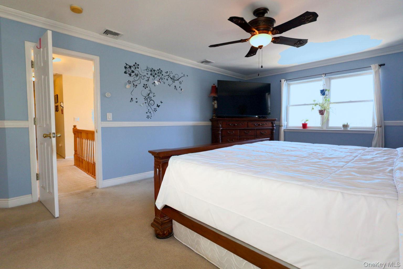 9 Mt Ridge Court Monroe, NY 10950 - Photo 36 of 49 a bedroom with a bed and a chandelier