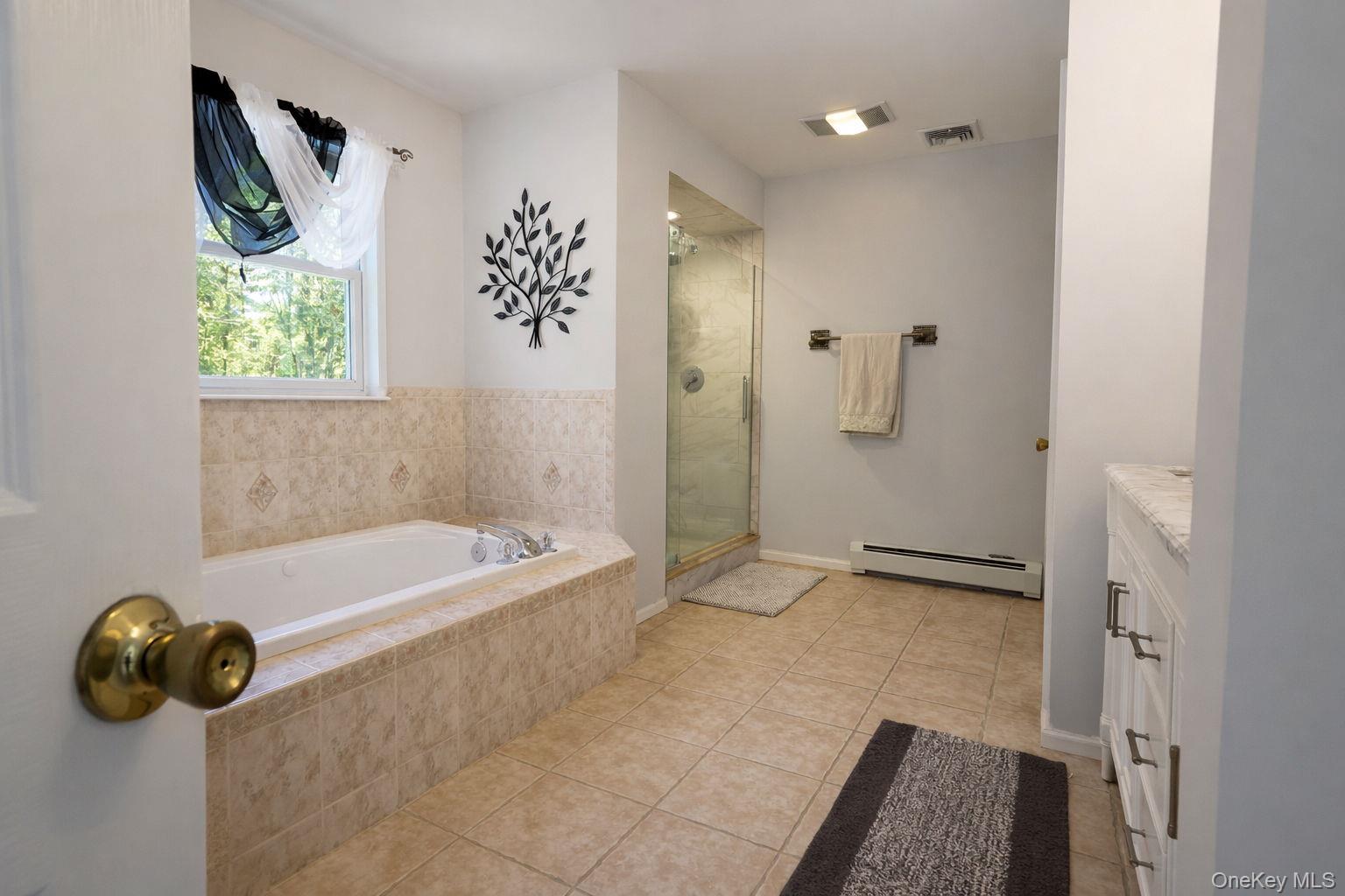 9 Mt Ridge Court Monroe, NY 10950 - Photo 38 of 49 a bathroom with a tub sink and mirror