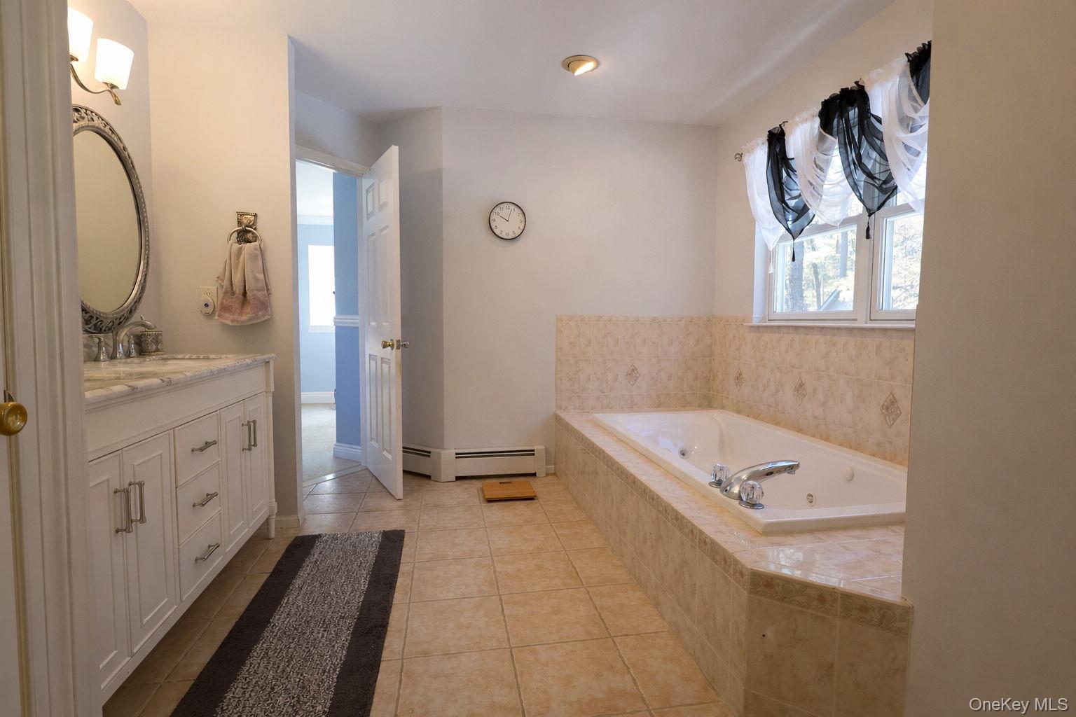 9 Mt Ridge Court Monroe, NY 10950 - Photo 40 of 49 a bathroom with a tub sink and mirror