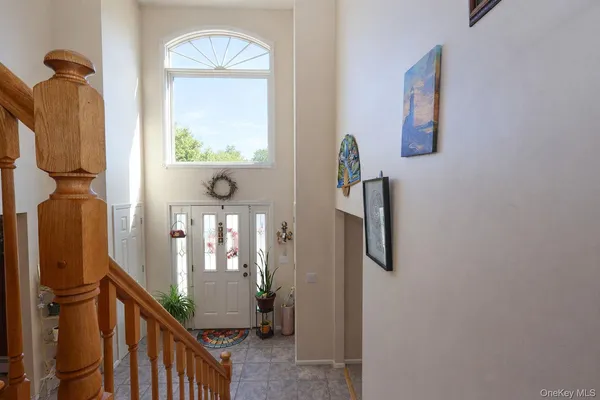 a view of an entryway with wooden floor