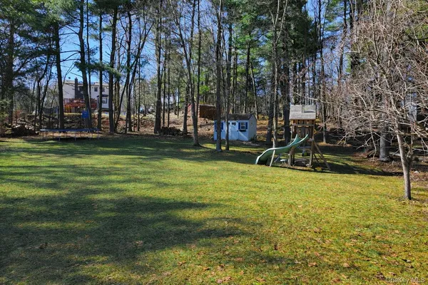 a view of a house with a big yard