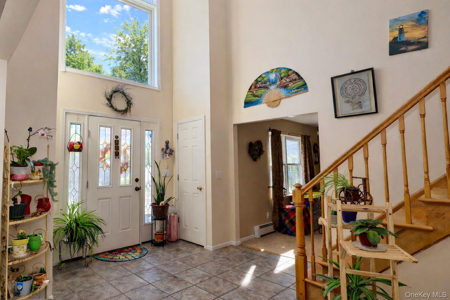 9 Mt Ridge Court Monroe, NY 10950 - Photo 7 of 49 a view of staircase with furniture and a window