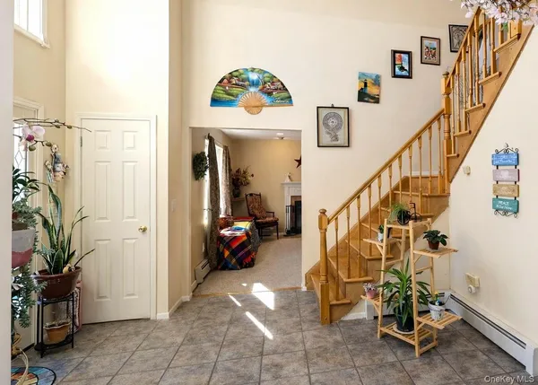 a kitchen with kitchen island granite countertop appliances cabinets and a sink