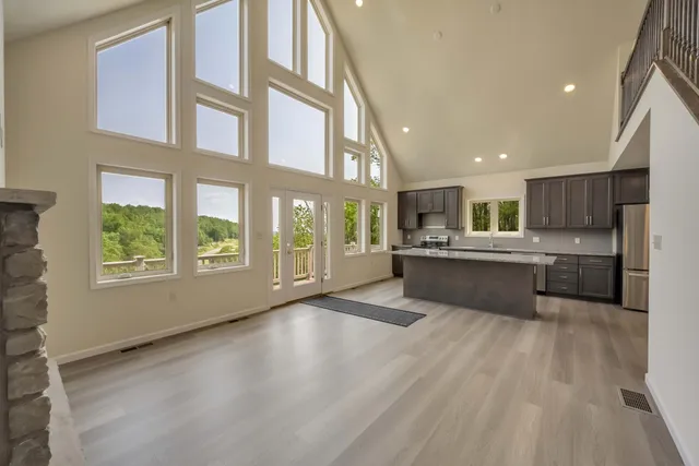 a view of backyard with a deck