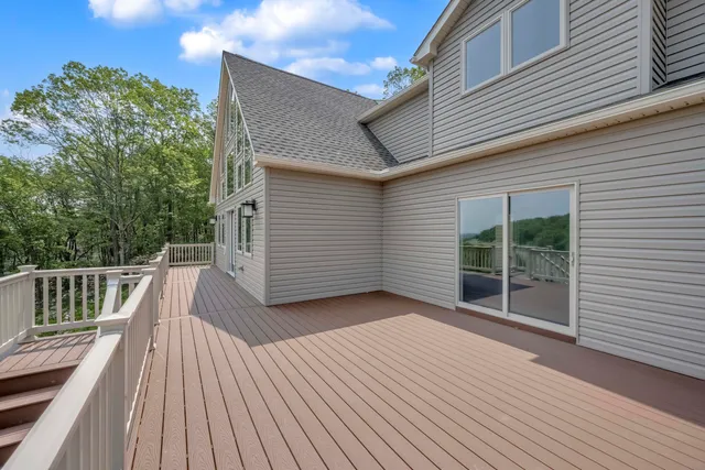 a balcony with wooden floor