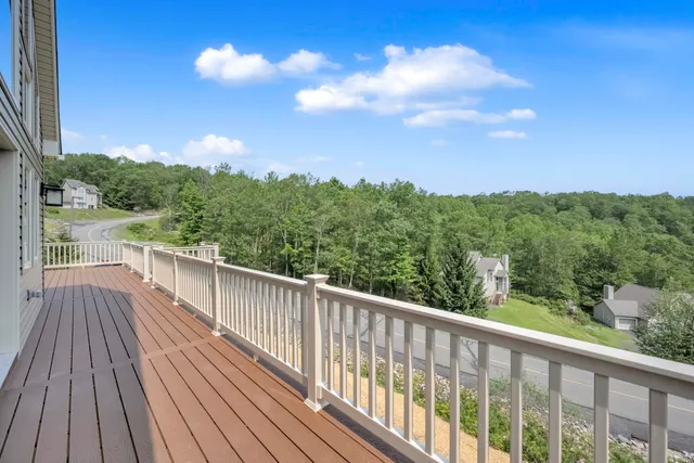 a view of a kitchen with a sink and a large window