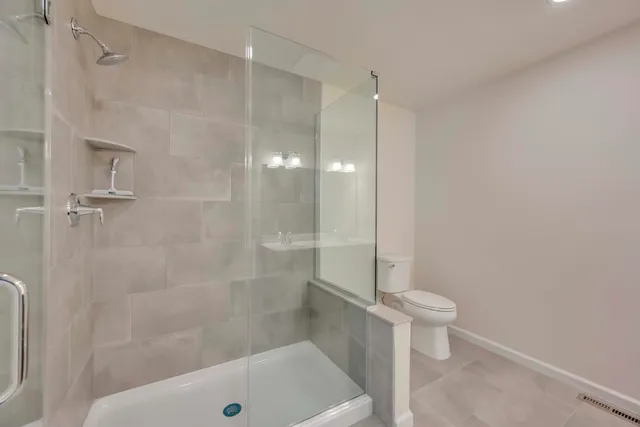 an aerial view of a house with a yard and large trees