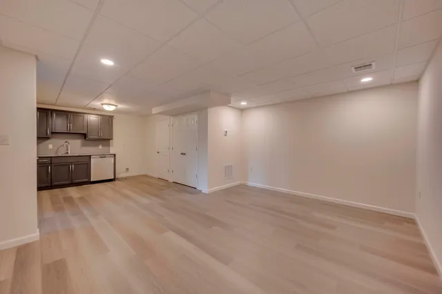 a view of a kitchen with a sink and a stove top oven