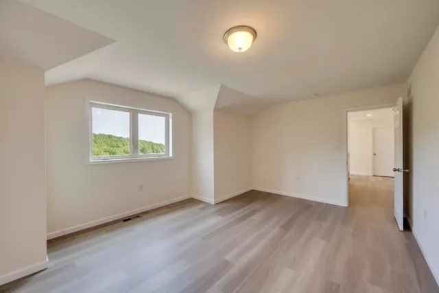 a view of a city with mountains in the background