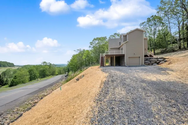 a view of a backyard with trees