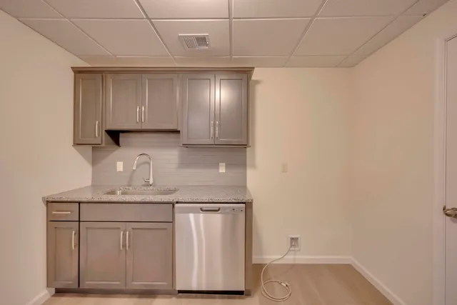 a kitchen with a sink and cabinets