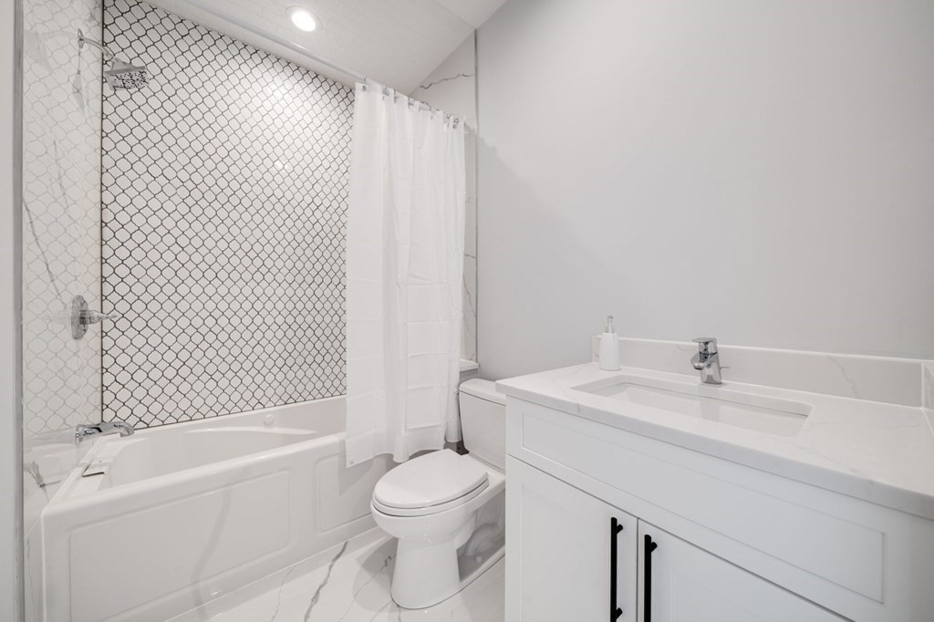 66 Fawndale Road, Unit 3 Boston, MA 02131 - Photo 11 of 15 a bathroom with a sink toilet and shower