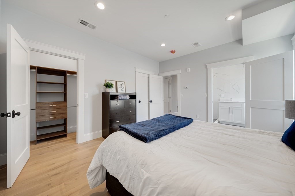 66 Fawndale Road, Unit 3 Boston, MA 02131 - Photo 13 of 15 a bedroom with a bed and closet