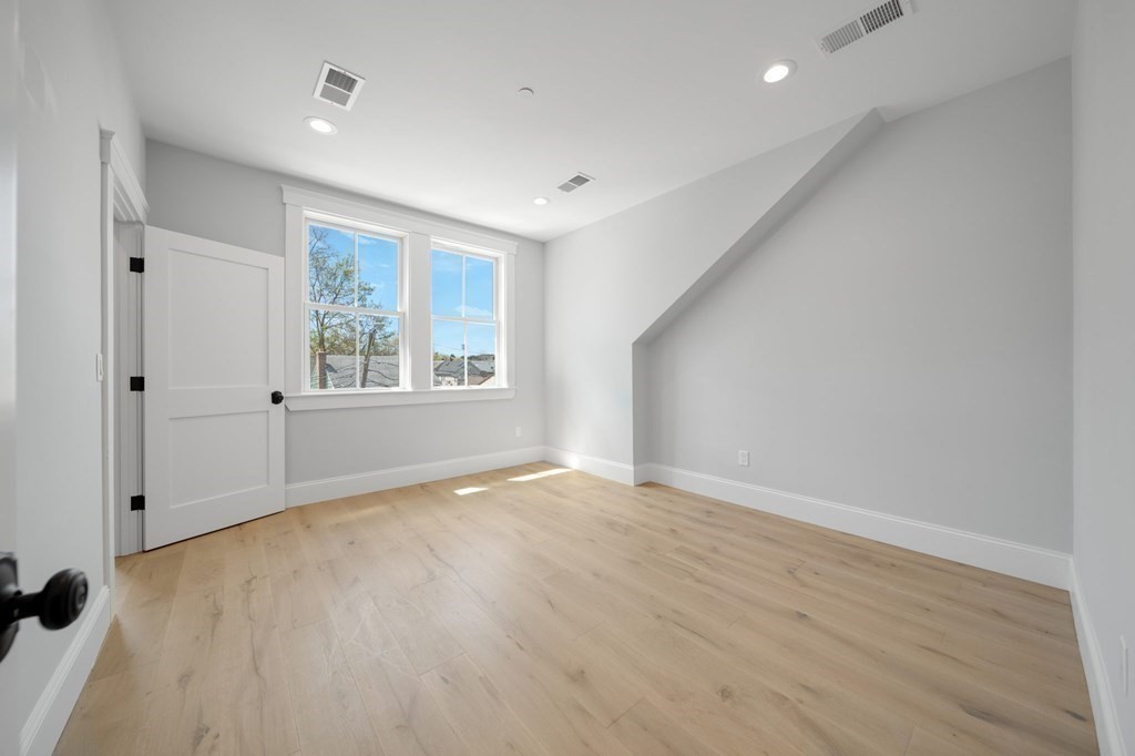 66 Fawndale Road, Unit 3 Boston, MA 02131 - Photo 9 of 15 a view of an empty room with a window
