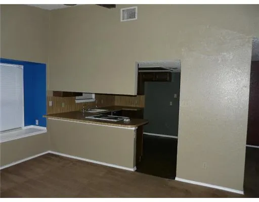 a kitchen with a stove and a refrigerator