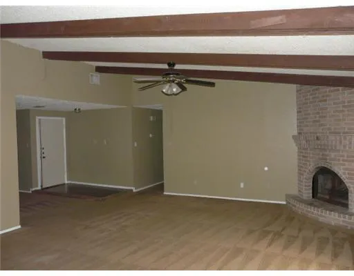 a view of entryway with a fireplace