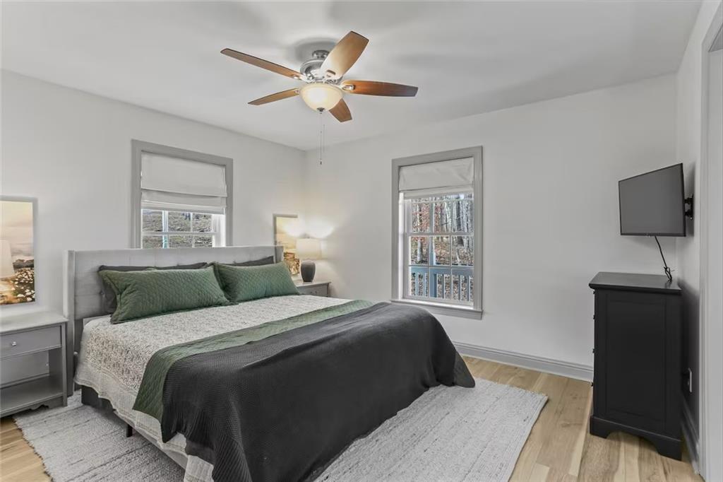 44 Sheffield Court Sparta, GA 31087 - Photo 16 of 24 a bedroom with a large bed and a window