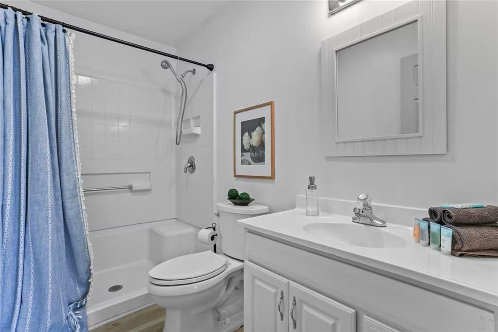 44 Sheffield Court Sparta, GA 31087 - Photo 22 of 24 a bathroom with a sink toilet and shower