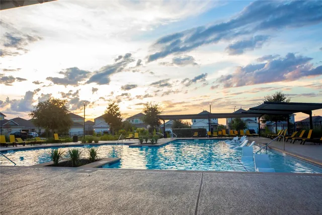 a view of house with outdoor space and sitting area