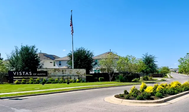 a view of a house with a yard and plants